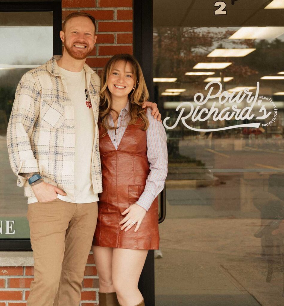 Corey and Colleen in front of the store
